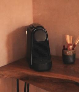 a black heater sitting on top of a wooden shelf at Nikau Hotel El Cuyo - Adults Only in El Cuyo