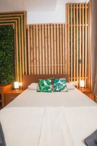 Postel nebo postele na pokoji v ubytování Banana Beach Patacona Rooms