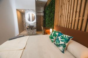 Postel nebo postele na pokoji v ubytování Banana Beach Patacona Rooms