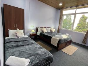 Postel nebo postele na pokoji v ubytování Williams Homestay