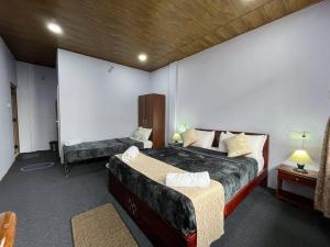 Postel nebo postele na pokoji v ubytování Williams Homestay