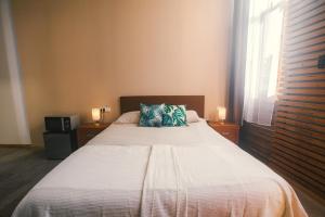 Postel nebo postele na pokoji v ubytování Banana Beach Patacona Rooms
