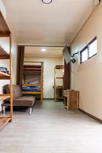 a room with a bed and bunk beds at Good Vibes Apartments in Talamanca