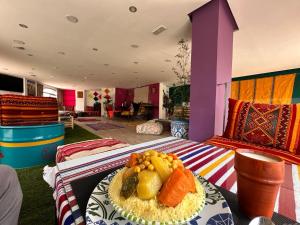 a room with a bed with a plate of food on it at Lovely Apartment in Tangier