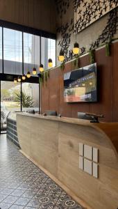 a lobby with a reception desk in a building at Hangar Inn Select Aeropuerto Guadalajara in Guadalajara