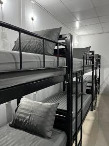 a group of bunk beds in a room at Funny Moon Hostel in Haad Rin