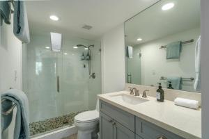 a bathroom with a shower and a toilet and a sink at Walkable to Beach, Restaurants & Shops. Remodeled! in Wailea