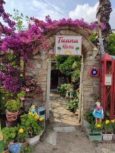 a flower shop with a sign that reads lettuce home at Side Tuana Garden Home in Side