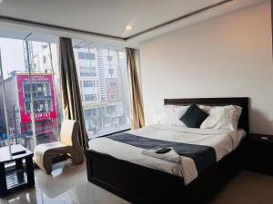 מיטה או מיטות בחדר ב-Wildwings hotel
