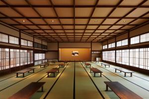 a large room with benches and windows at The Gate Hotel Kyoto Takasegawa by Hulic in Kyoto