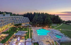 an aerial view of a hotel with a swimming pool at Hotel Mediteran Plava Laguna in Poreč
