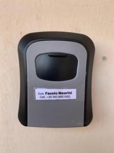 a black and white object attached to a wall at SulLago Appartamenti - Appartamento incantevole con Piscina in Castiglione del Lago
