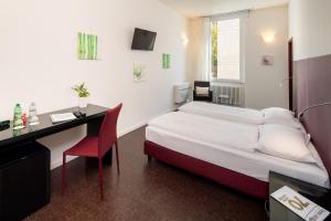 Ένα ή περισσότερα κρεβάτια σε δωμάτιο στο Hotel Rio Muralto
