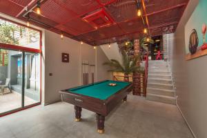 a pool table in a room with a staircase at Taksim Nis Hotel- Special Category in Istanbul