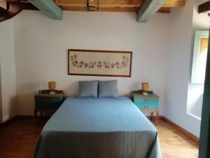 A bed or beds in a room at Casas Rurales Casas en Batuecas