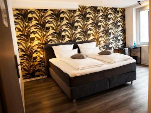 Postel nebo postele na pokoji v ubytování Hotel KUMP365