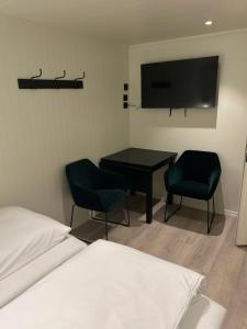 Postel nebo postele na pokoji v ubytování Finsnes Gaard