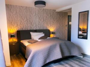 Postel nebo postele na pokoji v ubytování Hotel KUMP365