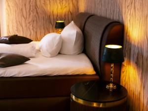 Postel nebo postele na pokoji v ubytování Hotel KUMP365