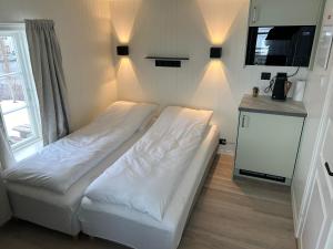 Postel nebo postele na pokoji v ubytování Finsnes Gaard