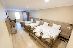Postel nebo postele na pokoji v ubytování World Point Hotel Besyol