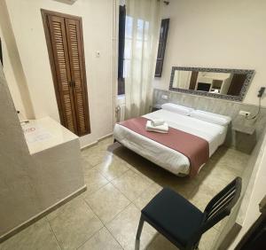 Postel nebo postele na pokoji v ubytování Arteaga Hostal & Baños Arabes Elvira