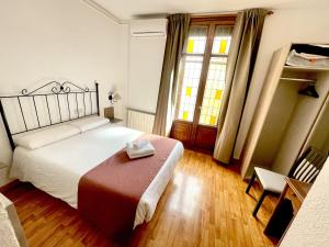 Postel nebo postele na pokoji v ubytování Arteaga Hostal & Baños Arabes Elvira