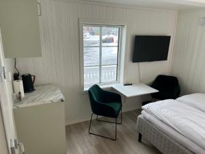 Postel nebo postele na pokoji v ubytování Finsnes Gaard