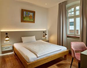 Postel nebo postele na pokoji v ubytování Hotel & Restaurant Burgschänke