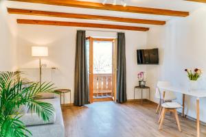 a living room with a couch and a table at Ferienwohnungen Quellenhof in Bad Reichenhall
