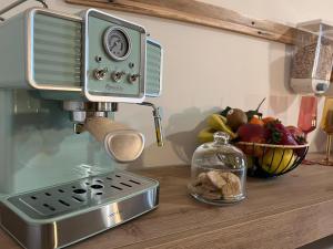 a mixer on a counter with a bowl of fruit at A Casa di Giuseppa Natura bio in Caserta