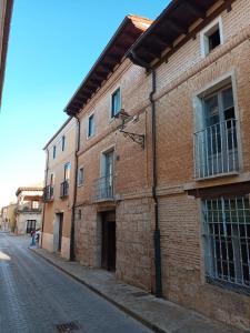a brick building on the side of a street at Casa Nicola in Toro