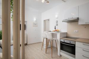 Kuchyň nebo kuchyňský kout v ubytování Elegant apartment next to Arena