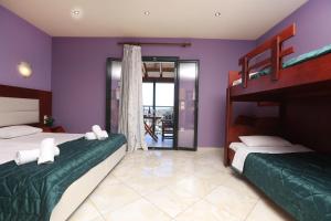 Postel nebo postele na pokoji v ubytování Corfu Hotel Apartments