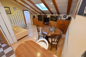 a kitchen and dining room with a table and chairs at Apartment Eva in Zadar