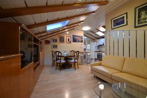 a living room with a couch and a table at Apartment Eva in Zadar