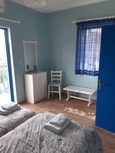 Postel nebo postele na pokoji v ubytování Blue Garden