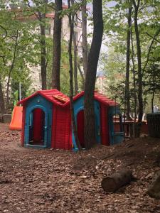 a red and blue play house in the woods at bakuriani didveli rezidensi G6 in Borjomi