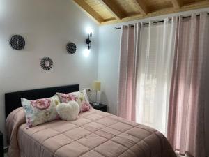 Ένα ή περισσότερα κρεβάτια σε δωμάτιο στο Casa Delia