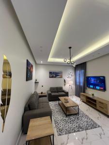 a living room with a couch and a tv at تراحيب ابها - tarahib abha in Abha