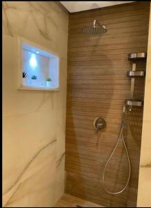 a bathroom with a shower with a window at Islan bay apartment in Agadir