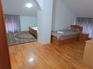 Postel nebo postele na pokoji v ubytování Hotel Daniel