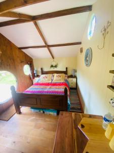 a bedroom with a bed in a room at Tyluna Cornish Cabin in Praze an Beeble