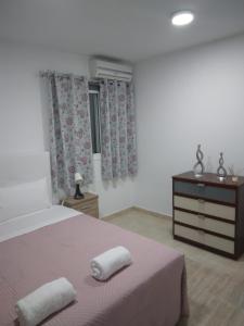 En eller flere senge i et værelse på Casa Ángel