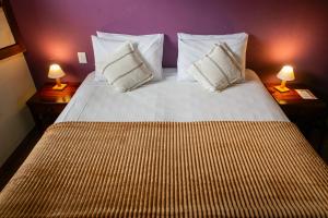 Кровать или кровати в номере Pousada Jardon Ubatuba
