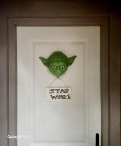 a door with a sign that says star wurst at Star Wars + Jacuzzi à 10 minutes de Disneyland in Condé-Sainte-Libiaire
