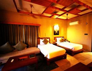 Katil atau katil-katil dalam bilik di Hotel Sonar Bangla Sundarban