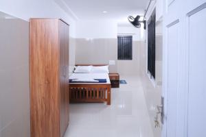 Postel nebo postele na pokoji v ubytování Asian Nest Serviced Apartments