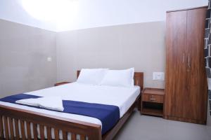 Postel nebo postele na pokoji v ubytování Asian Nest Serviced Apartments