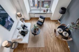 an overhead view of a living room with a couch and chairs at Prime Location: Spacious & Central in Oslo